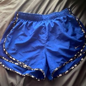blue Nike shorts with flower trim